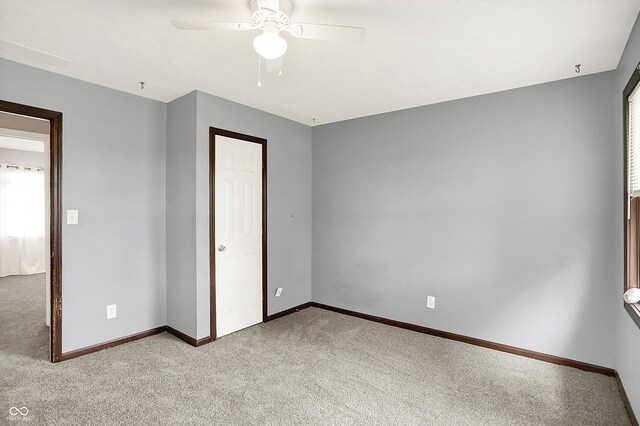 6838 Five Points Rd, Indianapolis, IN 46259 - unfurnished bedroom featuring light carpet, baseboards, and a ceiling fan