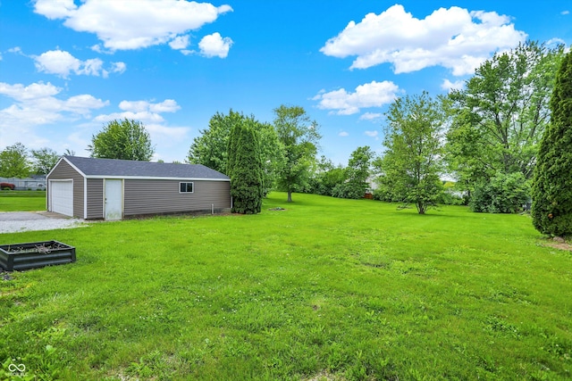 6838 Five Points Rd, Indianapolis, IN 46259 - view of grassy yard with an outbuilding and a garage