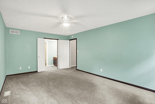 6838 Five Points Rd, Indianapolis, IN 46259 - unfurnished bedroom featuring carpet, baseboards, a ceiling fan, and a textured ceiling