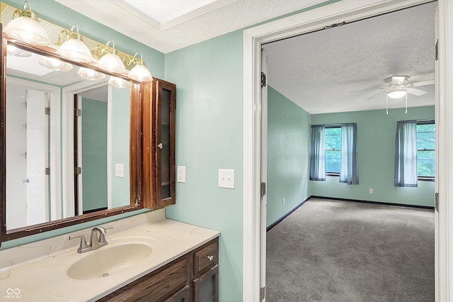 6838 Five Points Rd, Indianapolis, IN 46259 - bathroom with vanity, a ceiling fan, a textured ceiling, and baseboards