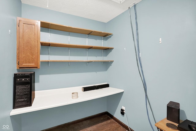 6838 Five Points Rd, Indianapolis, IN 46259 - unfurnished office featuring dark wood-type flooring, baseboards, and a textured ceiling