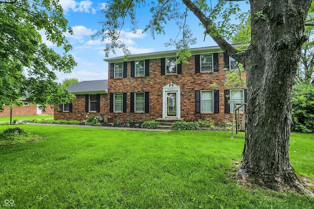 6838 Five Points Rd, Indianapolis, IN 46259 - colonial-style house featuring a front yard and brick siding