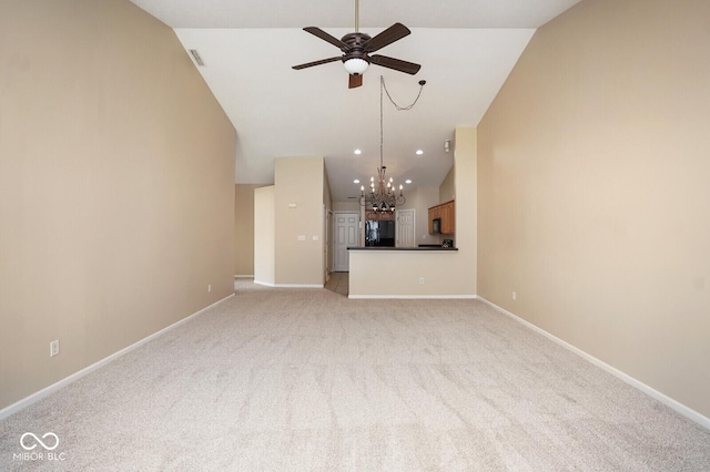 6105 Franklin Villas Way, Indianapolis, IN 46237 - unfurnished living room featuring a ceiling fan, a chandelier, vaulted ceiling, light carpet, and baseboards