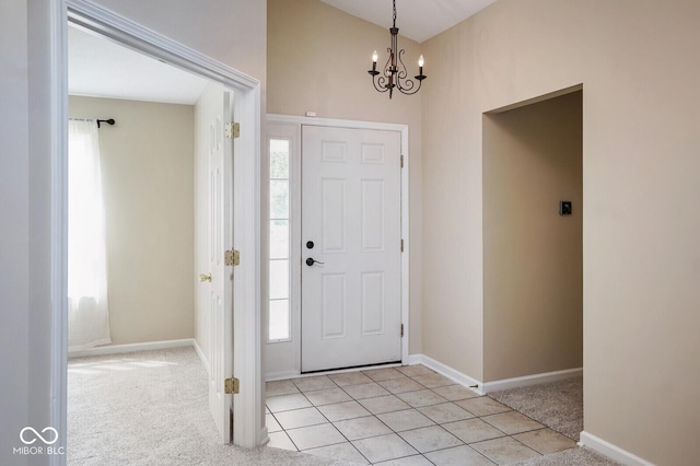 6105 Franklin Villas Way, Indianapolis, IN 46237 - entrance foyer featuring a chandelier, baseboards, and light colored carpet