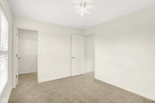 7046 Allegiance Ct, Indianapolis, IN 46259 - unfurnished bedroom with carpet floors, a closet, baseboards, and a spacious closet