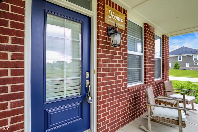 7046 Allegiance Ct, Indianapolis, IN 46259 - property entrance featuring covered porch and brick siding