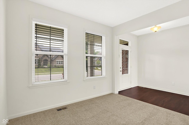 7046 Allegiance Ct, Indianapolis, IN 46259 - spare room with dark colored carpet and baseboards