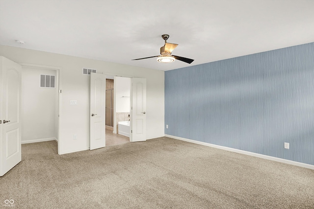 7046 Allegiance Ct, Indianapolis, IN 46259 - unfurnished bedroom with carpet floors, baseboards, a ceiling fan, and ensuite bath