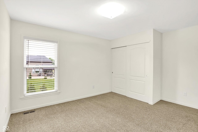 7046 Allegiance Ct, Indianapolis, IN 46259 - unfurnished bedroom with carpet floors, a closet, and baseboards