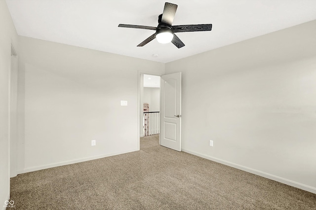 7046 Allegiance Ct, Indianapolis, IN 46259 - empty room featuring light carpet, baseboards, and ceiling fan