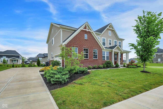 7046 Allegiance Ct, Indianapolis, IN 46259 - view of front of house with an attached garage, brick siding, concrete driveway, and a front yard