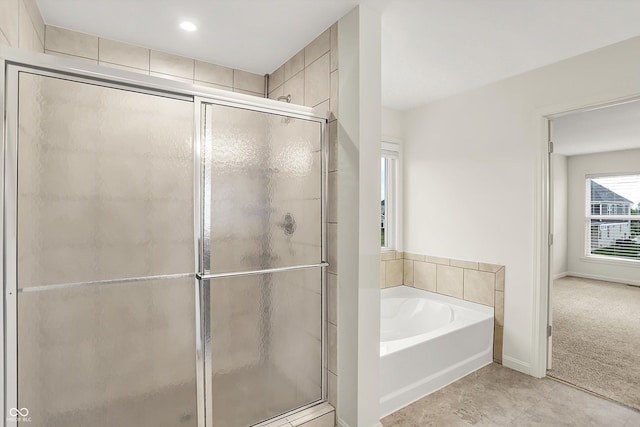 7046 Allegiance Ct, Indianapolis, IN 46259 - full bath with a stall shower, a bath, baseboards, and tile patterned flooring