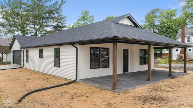 615 W Cherry St, Scottsburg, IN 47170 - rear view of property featuring a shingled roof and a patio
