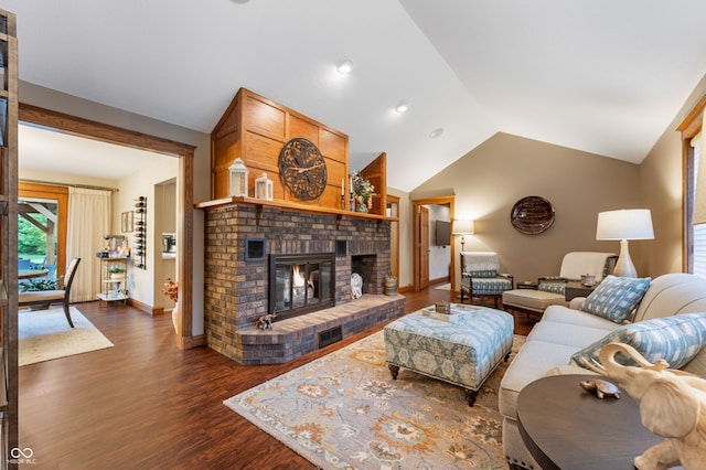 2411 N County Road 500 W, Muncie, IN 47304 - living area with vaulted ceiling, dark wood-style floors, a fireplace, and baseboards