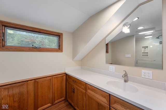 2411 N County Road 500 W, Muncie, IN 47304 - bathroom featuring vanity, lofted ceiling, and wood finished floors