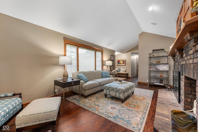 2411 N County Road 500 W, Muncie, IN 47304 - living room featuring vaulted ceiling, a fireplace, wood finished floors, and baseboards