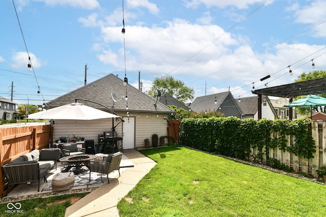 635 E 10th St, Indianapolis, IN 46202 - view of yard featuring a patio and an outdoor living space with a fire pit