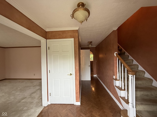 6609 N Tuxedo Ln, Indianapolis, IN 46220 - hall featuring baseboards, stairway, crown molding, and a textured ceiling