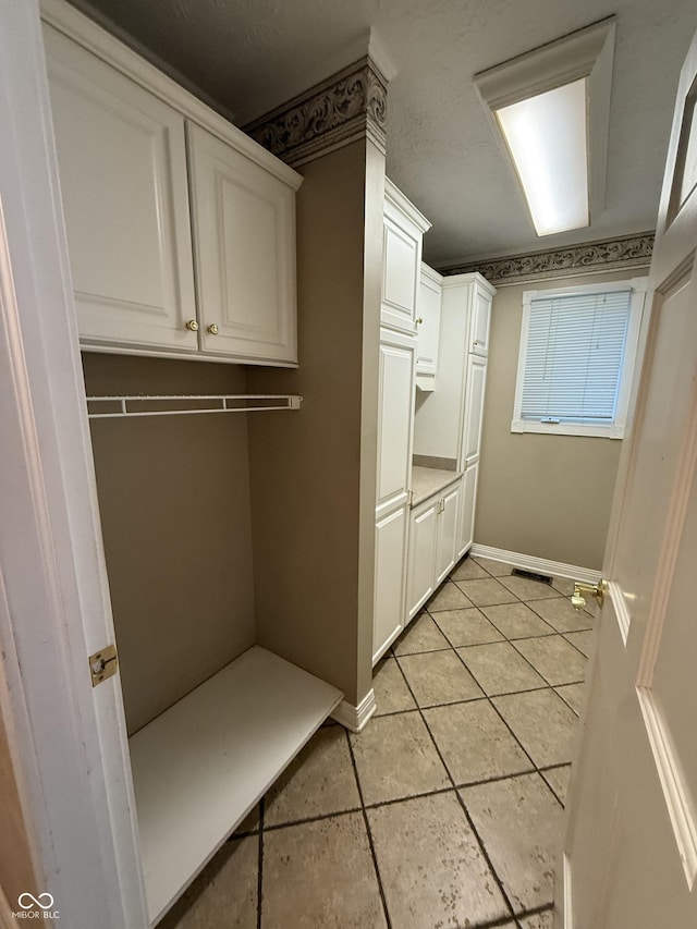 6609 N Tuxedo Ln, Indianapolis, IN 46220 - spacious closet with light tile patterned floors