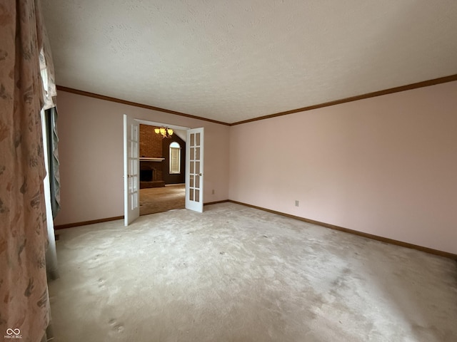 6609 N Tuxedo Ln, Indianapolis, IN 46220 - empty room with french doors, light carpet, baseboards, ornamental molding, and a chandelier