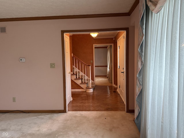 6609 N Tuxedo Ln, Indianapolis, IN 46220 - corridor with baseboards, ornamental molding, stairs, and carpet flooring