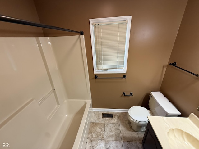 6609 N Tuxedo Ln, Indianapolis, IN 46220 - full bathroom featuring toilet, vanity, baseboards, and tile patterned flooring