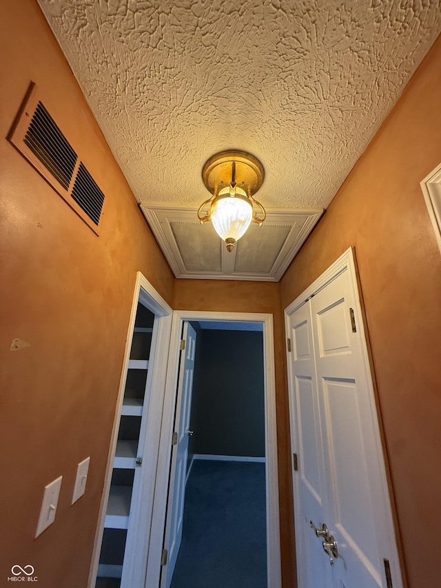 6609 N Tuxedo Ln, Indianapolis, IN 46220 - hallway featuring a textured ceiling