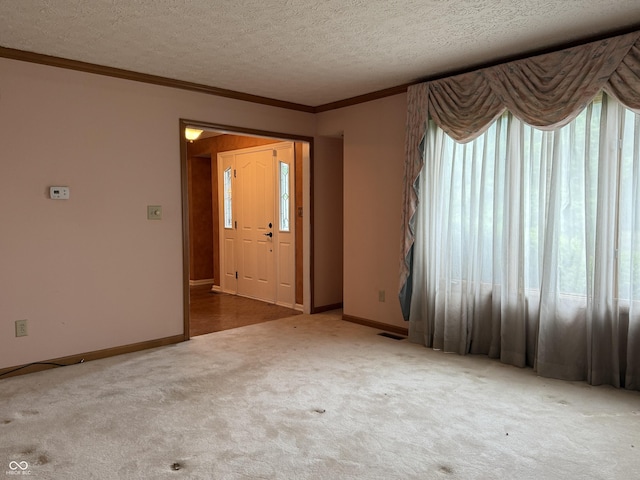 6609 N Tuxedo Ln, Indianapolis, IN 46220 - carpeted empty room featuring ornamental molding, a textured ceiling, and baseboards