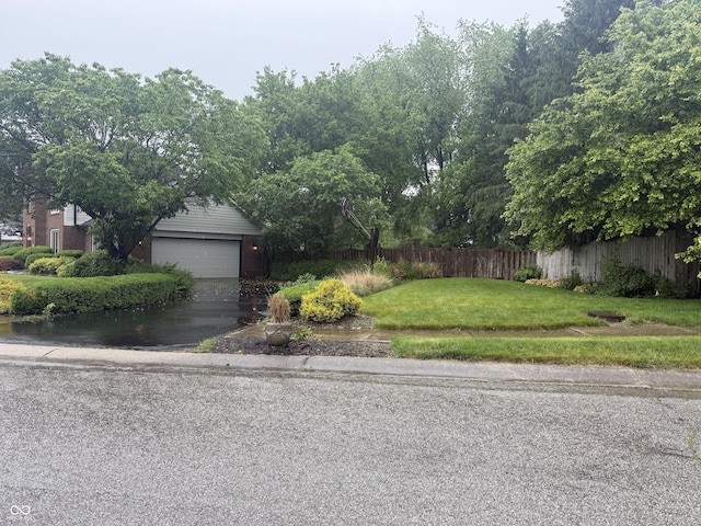 6609 N Tuxedo Ln, Indianapolis, IN 46220 - view of front of home featuring brick siding, asphalt driveway, and a garage