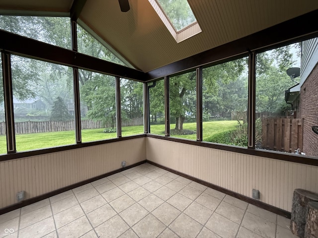 6609 N Tuxedo Ln, Indianapolis, IN 46220 - unfurnished sunroom with a skylight, vaulted ceiling, a ceiling fan, and plenty of natural light