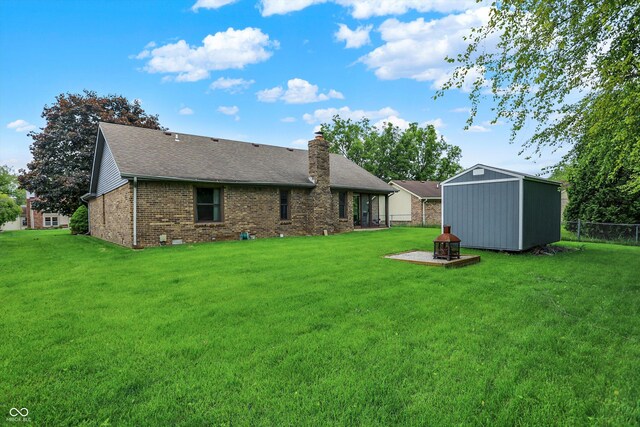 926 Brookside Ln, Plainfield, IN 46168 - rear view of house with a chimney, brick siding, and roof with shingles