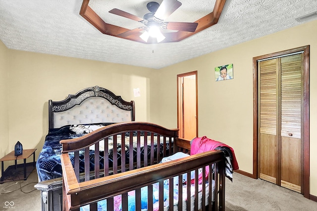 926 Brookside Ln, Plainfield, IN 46168 - carpeted bedroom with a textured ceiling, baseboards, a closet, and a ceiling fan