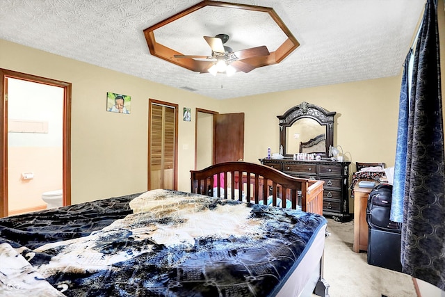 926 Brookside Ln, Plainfield, IN 46168 - bedroom featuring light colored carpet, a textured ceiling, ensuite bath, and a ceiling fan