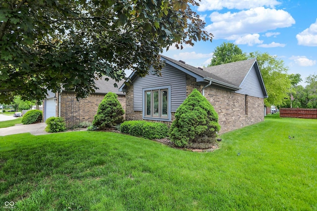926 Brookside Ln, Plainfield, IN 46168 - view of side of home with brick siding, a shingled roof, and a garage