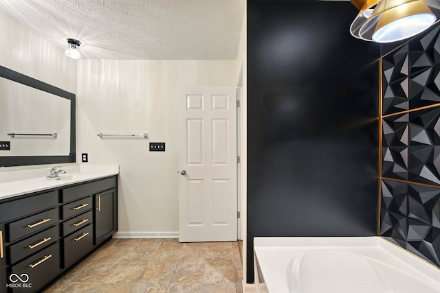 1454 Silver Pine Ln, Sheridan, IN 46069 - bathroom featuring vanity, a bathtub, baseboards, and a textured ceiling