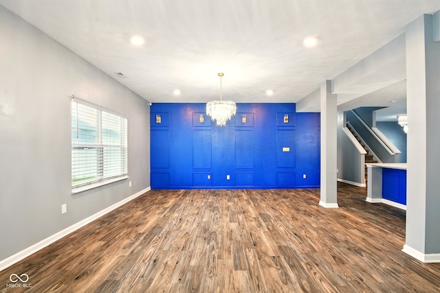 1454 Silver Pine Ln, Sheridan, IN 46069 - unfurnished dining area with stairway, baseboards, dark wood finished floors, a chandelier, and recessed lighting