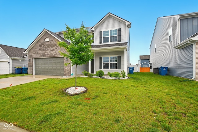 1454 Silver Pine Ln, Sheridan, IN 46069 - traditional home with concrete driveway, an attached garage, a front lawn, and brick siding