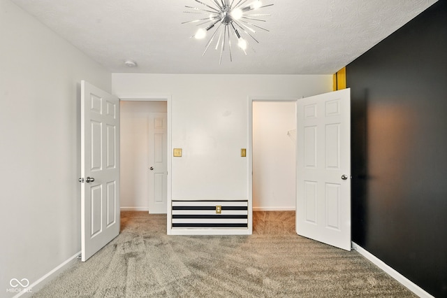 1454 Silver Pine Ln, Sheridan, IN 46069 - unfurnished bedroom featuring carpet floors, a chandelier, and baseboards