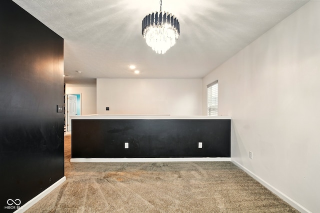 1454 Silver Pine Ln, Sheridan, IN 46069 - spare room with carpet, a chandelier, and baseboards