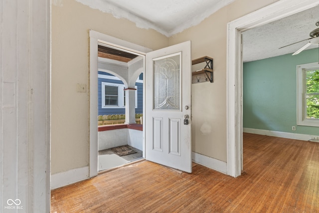 3134 N College Ave, Indianapolis, IN 46205 - foyer with wood finished floors, ceiling fan, baseboards, and crown molding