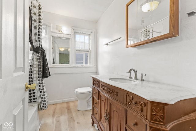 3134 N College Ave, Indianapolis, IN 46205 - bathroom with vanity, wood finished floors, and toilet