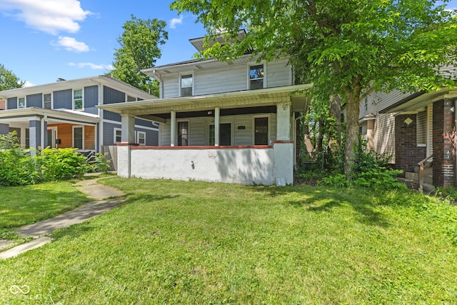 3134 N College Ave, Indianapolis, IN 46205 - rear view of property featuring a lawn and covered porch