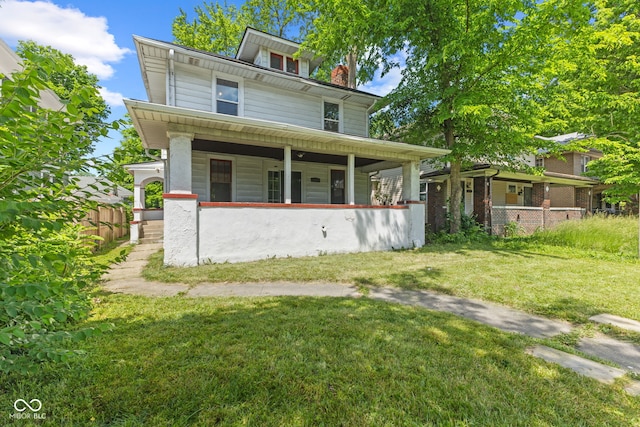 3134 N College Ave, Indianapolis, IN 46205 - american foursquare style home with a porch and a chimney