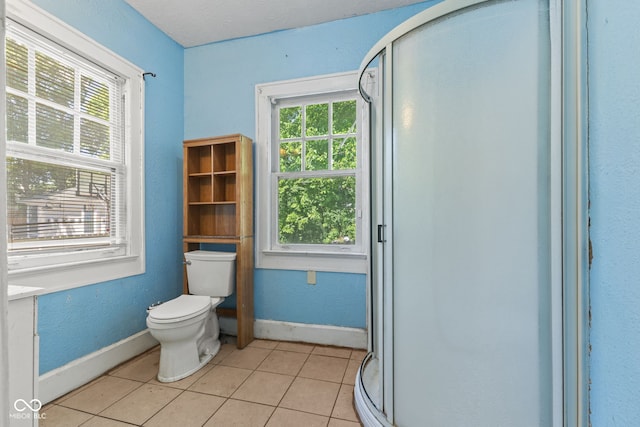 3134 N College Ave, Indianapolis, IN 46205 - full bathroom with toilet, tile patterned flooring, baseboards, and a stall shower