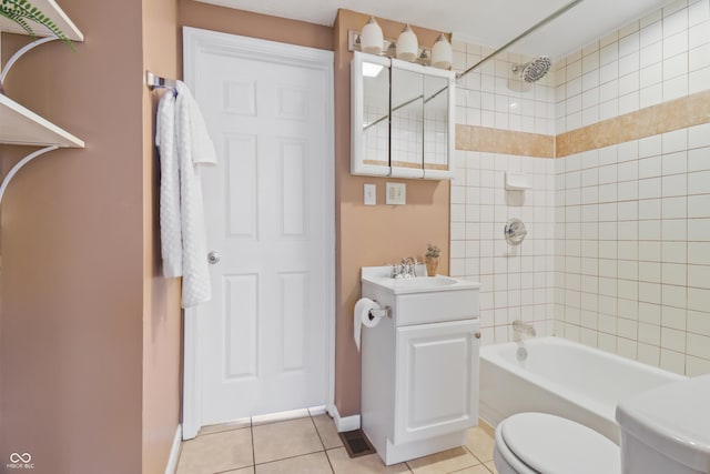1720 Woodlawn Ave, Indianapolis, IN 46203 - full bath with toilet, vanity, shower / bathtub combination, tile patterned floors, and baseboards
