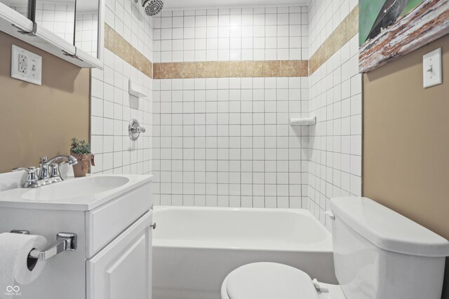 1720 Woodlawn Ave, Indianapolis, IN 46203 - bathroom featuring toilet, vanity, and tub / shower combination