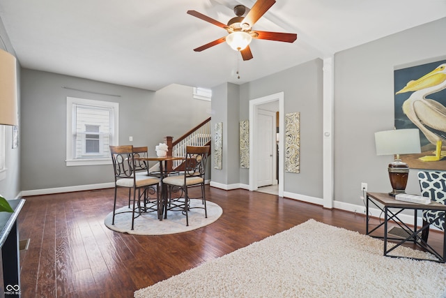 1720 Woodlawn Ave, Indianapolis, IN 46203 - dining space featuring stairs, ceiling fan, wood finished floors, and baseboards