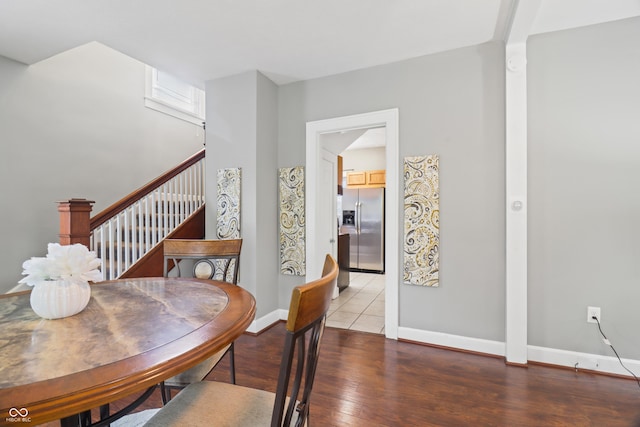1720 Woodlawn Ave, Indianapolis, IN 46203 - dining space featuring hardwood / wood-style floors, stairs, and baseboards