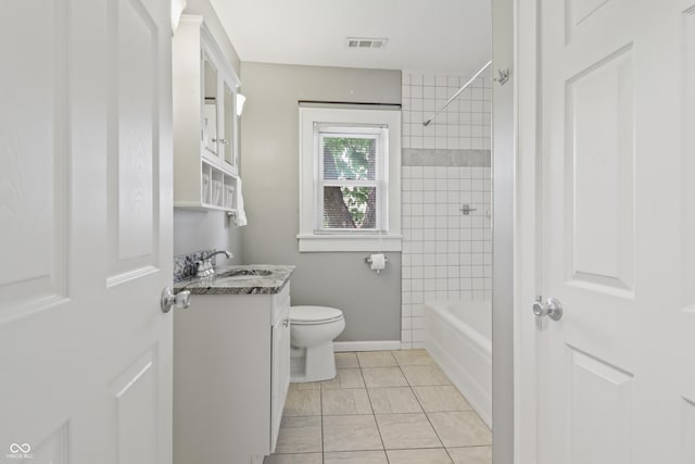 1720 Woodlawn Ave, Indianapolis, IN 46203 - bathroom with vanity, toilet, shower / tub combination, and baseboards