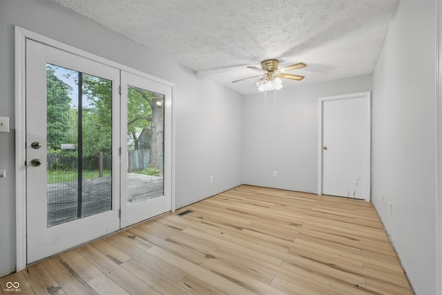 1826 Shorter Dr, Indianapolis, IN 46214 - spare room with a ceiling fan, light wood-style flooring, and a textured ceiling